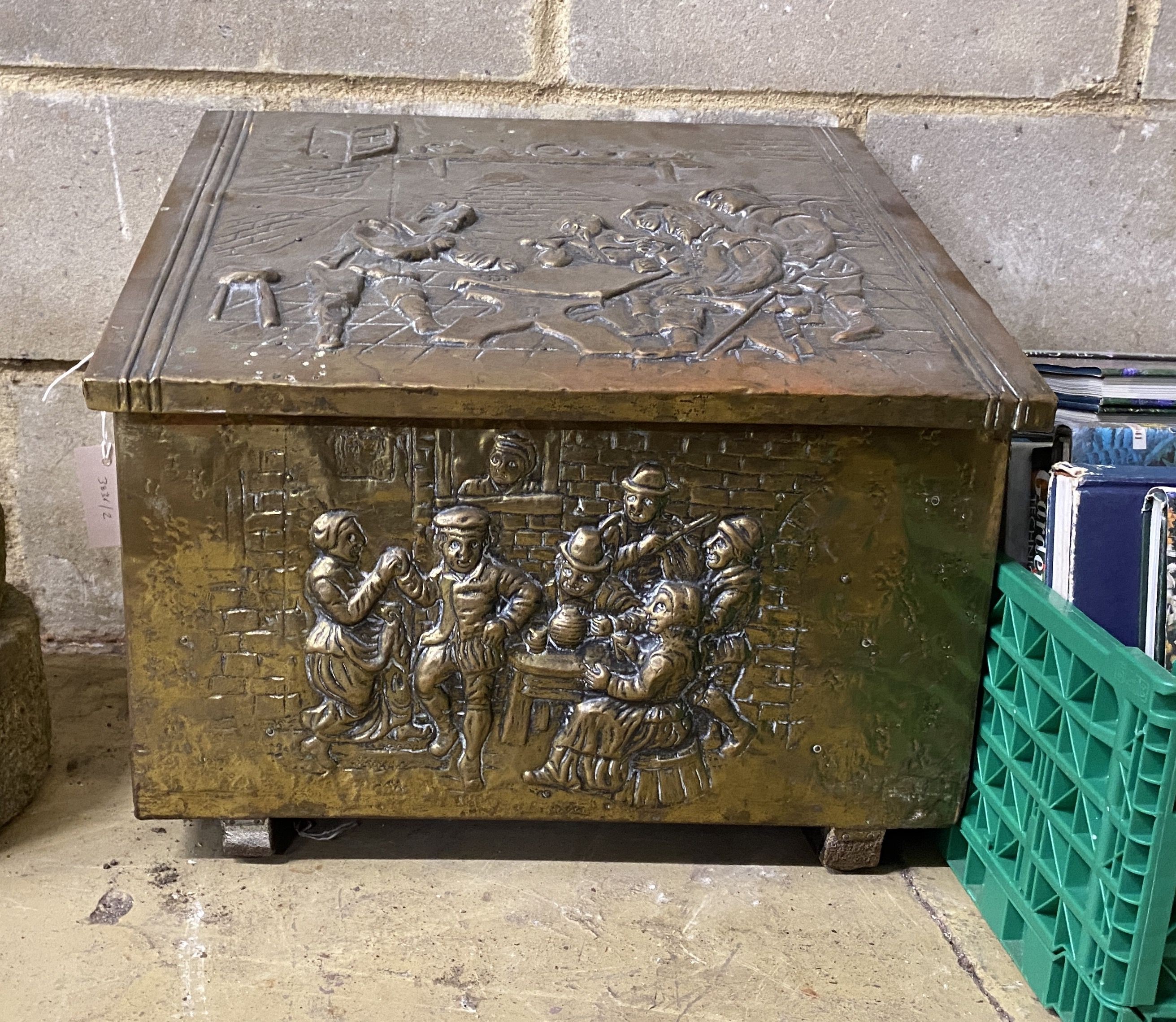 An antique Dutch embossed brass coal bin with handle, width 60cm, height 44cm